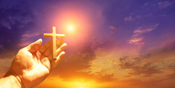 istock Good Friday concept. Cross in arm on sky background. 1480047648