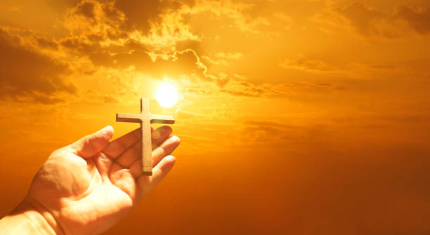 istock Good Friday concept. Cross in arm on sky background. 1480047662