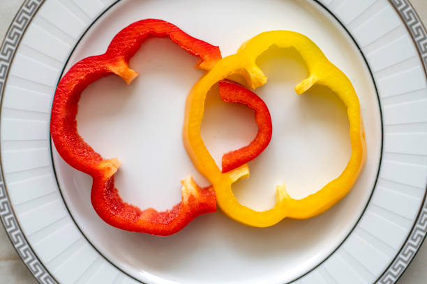 Red and yellow peppers background