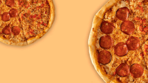 istock Pepperoni pizza on yellow background. Top view with copy space. 1480052870