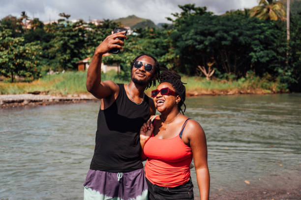 istock Couple taking a  selfie by a river 1480053309