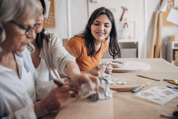 istock Women siblings learning clay art 1480057523