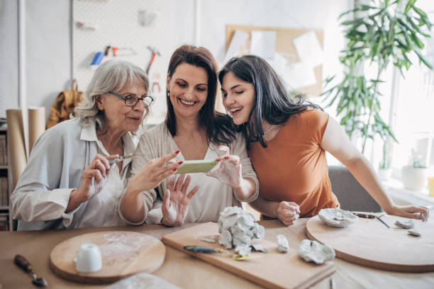istock Women siblings enjoying in clay art 1480059354