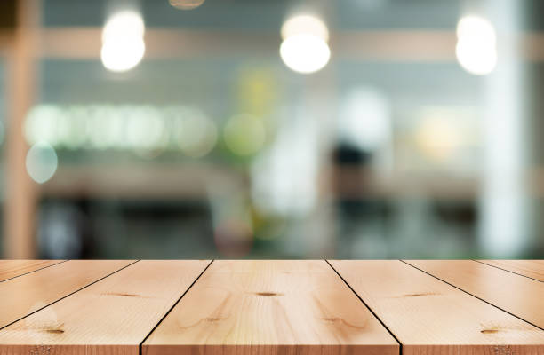 istock Empty wooden table top with lights bokeh on blur restaurant background. 1480061478
