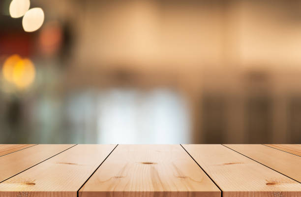 istock Empty wooden table top with lights bokeh on blur restaurant background. 1480061482