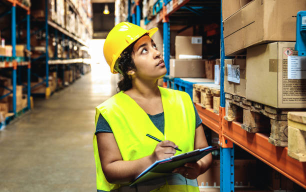istock Female warehouse worker working in a warehouse 1480061752