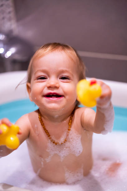 istock Happy baby girl is having a bath 1480061886