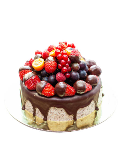 istock Cake decorated with strawberry dipped into melted chocolate, raspberry, blueberry and red currant. Isolated on plain background 1480061935