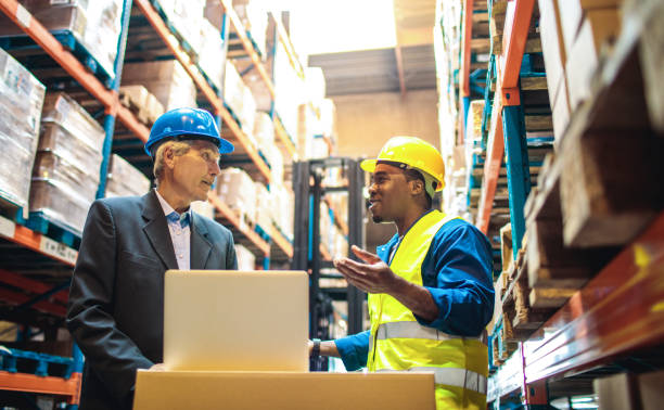 istock Warehouse worker talking to the warehouse manager 1480062247