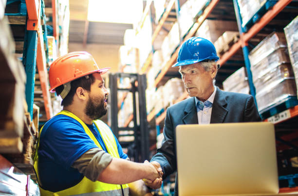 istock Warehouse worker talking to the warehouse manager 1480062475