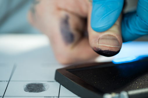 Taking fingerprints of criminal