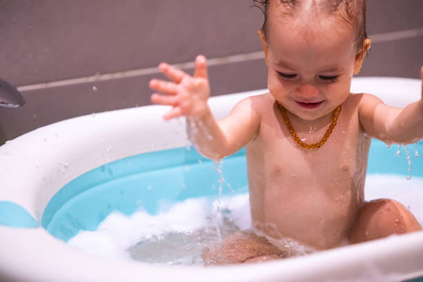 istock Happy baby girl is having a bath 1480062667