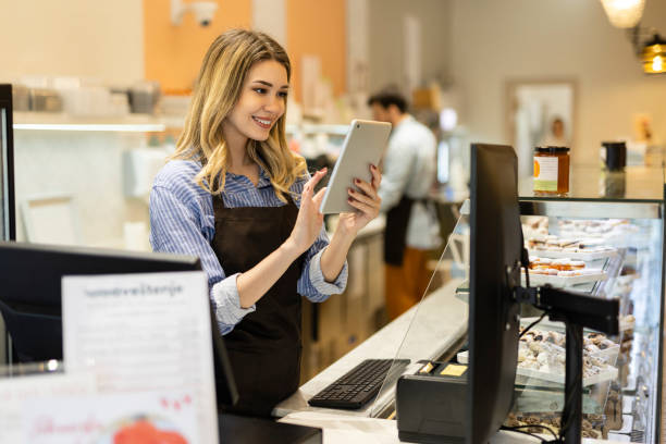 istock Smiling young baker at the checkout counter. 1480062770