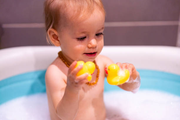 istock Happy baby girl is having a bath 1480062891