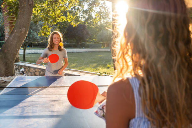 istock Girls playing table tennis on summer day 1480063477