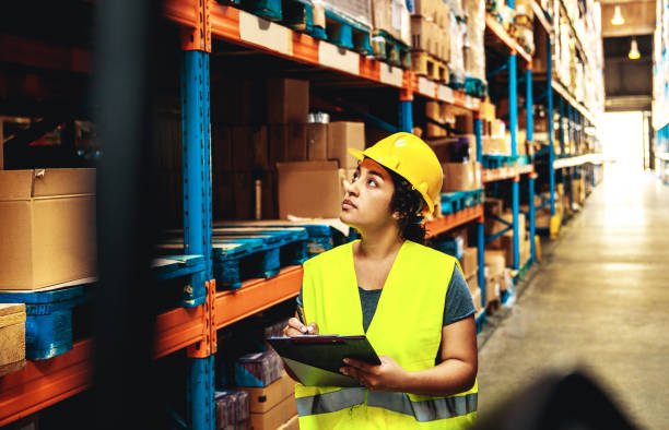 istock Female warehouse worker working in a warehouse 1480063568