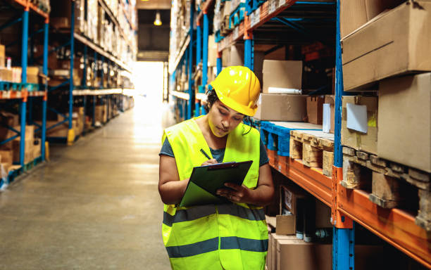 istock Female warehouse worker working in a warehouse 1480063591