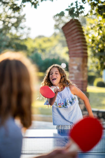 istock Girls playing table tennis on summer day 1480063735