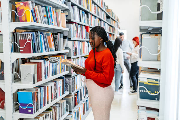 istock Female Student Reading A Book In A School Library 1480065407