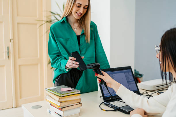 istock Female Student Renting A Book In A School Library 1480066082