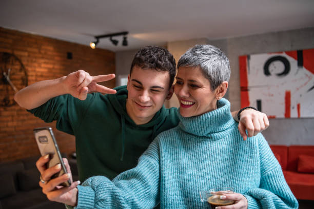 istock Mother and teenage son hugging 1480069279