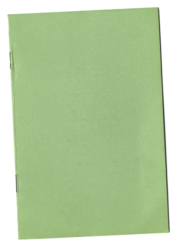 Blank cover of a green notebook with some creasing.