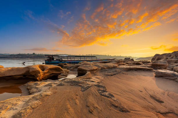 istock Ubon Ratchathani,Sunrise landscape photo with boat, mountain,Sam Phan Bok, Ubon Ratchathani, Thailand 1480071255