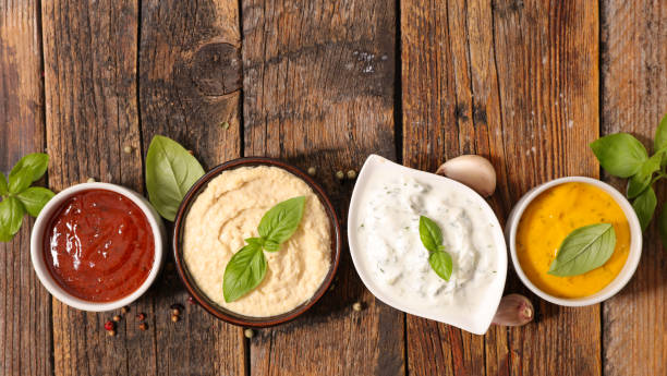 istock various of sauce- ketchup,  hummus,  mayo and cheddar cheese sauce 1480073178