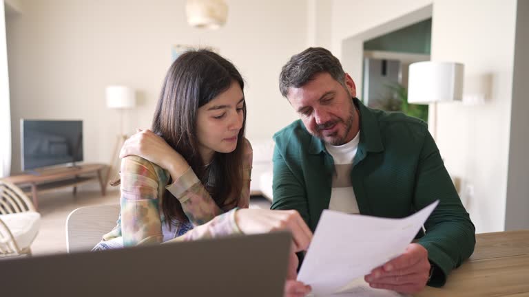 Father and daughter studying together