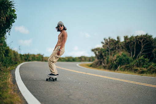 Asian skateboard enthusiasts use their skateboards to travel on the road, either to meet up with friends or to go to places where they can practice and experience skateboarding.