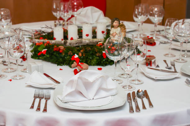 Hollyday table setting Gala diner table waiting for guests. Food and drink establishment. Hollyday table setting. Red colors. gala dinner table stock pictures, royalty-free photos & images