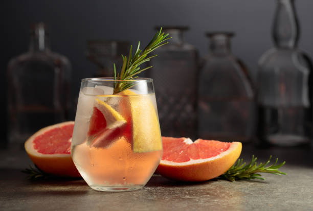 istock Cocktail gin tonic with ice, rosemary, and grapefruit. 1480084835
