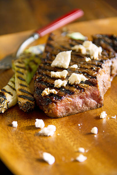 Grilled Strip Steak with Scallions & Feta stock photo