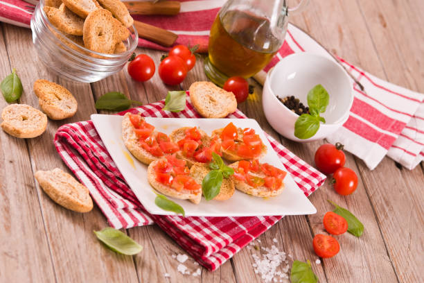 istock Friselle with cherry tomatoes and basil. 1480090125