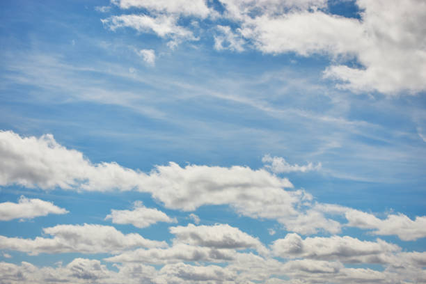 a beautiful blue sky with white clouds stock photo