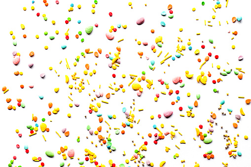 Easter background. Sprinkling with sugar balls and eggs, decoration for cake and baked goods