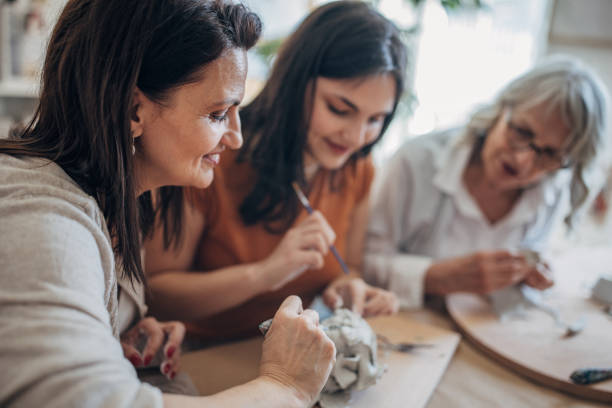 istock Women having fun with clay together 1480095300