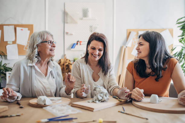 istock Female siblings molding clay together 1480096985
