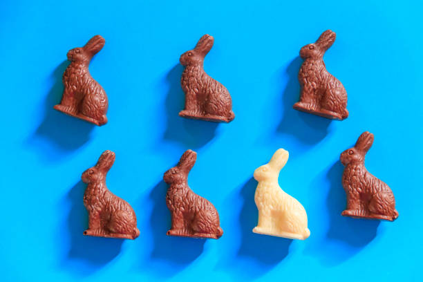 istock Easter chocolate bunnies on blue background. Top view 1480097299