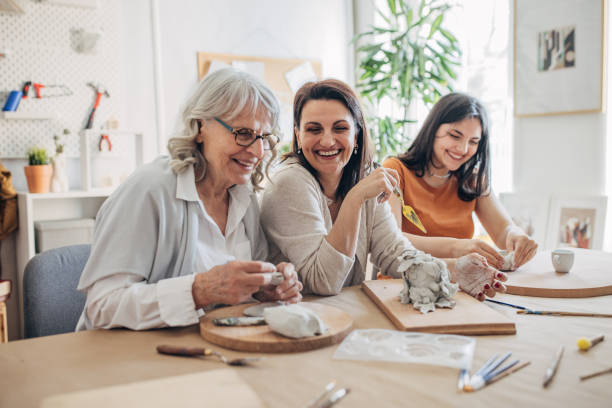 istock Female siblings molding clay together 1480097926