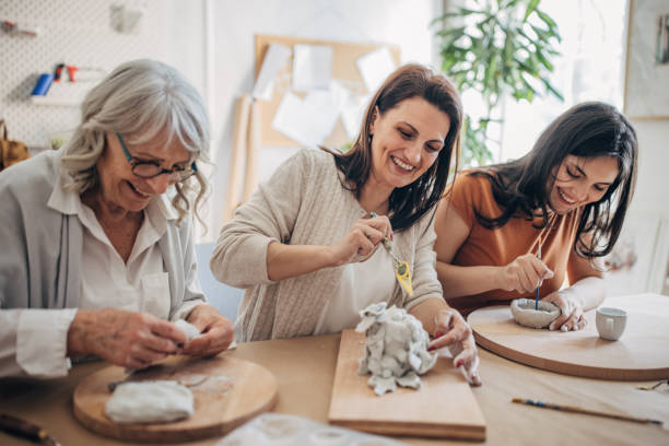 istock Female siblings making clay pottery 1480097952