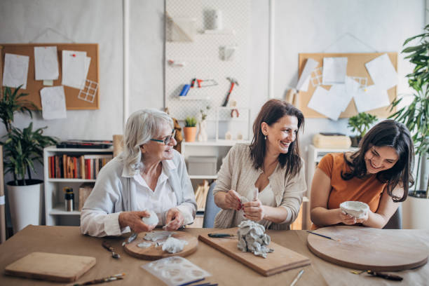 istock Female siblings making clay pottery 1480098091