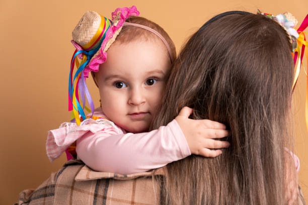 istock mother and daughter to Festa Junina hugging each other 1480098237