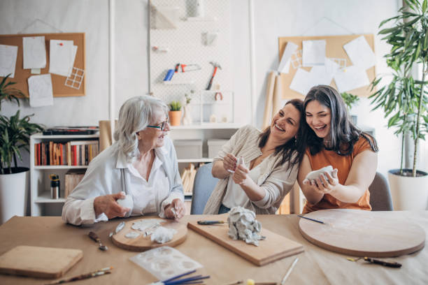 istock Female siblings making clay pottery 1480098536