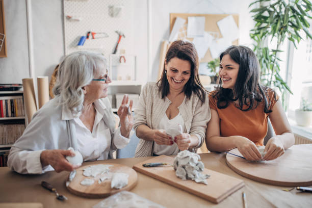 istock Female siblings making clay pottery 1480098842