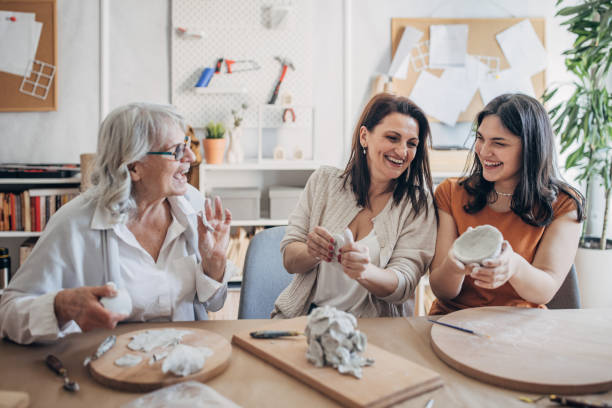istock Female siblings making clay pottery 1480098946