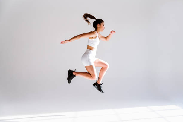 istock Young female athlete training in a gym using sport equipment 1480100946