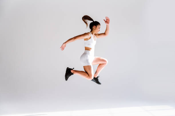 istock Young female athlete training in a gym using sport equipment 1480101291