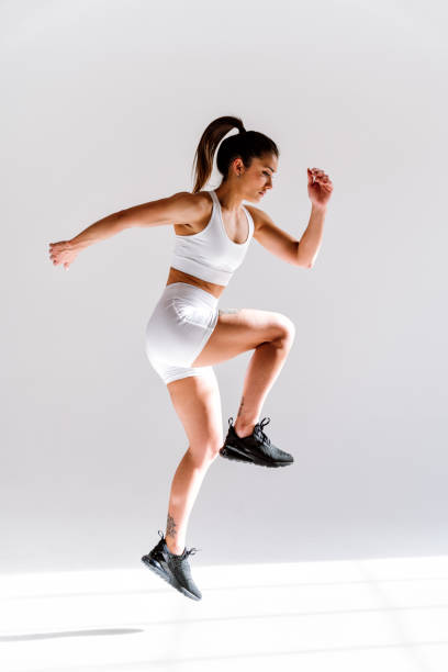 istock Young female athlete training in a gym using sport equipment 1480102303