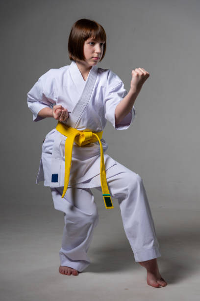 istock A karate girl trains in a kimono with punches and kicks 1480102802